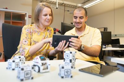 Faculty and student working to solve locomotion problem