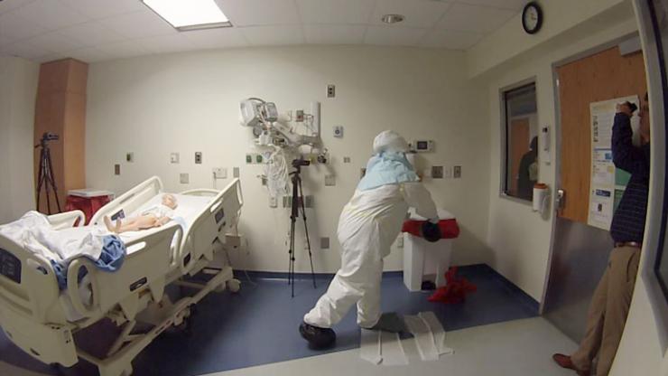 <p>Researchers observe simulations in one of the four state-designated Ebola treatment centers in Georgia.</p>