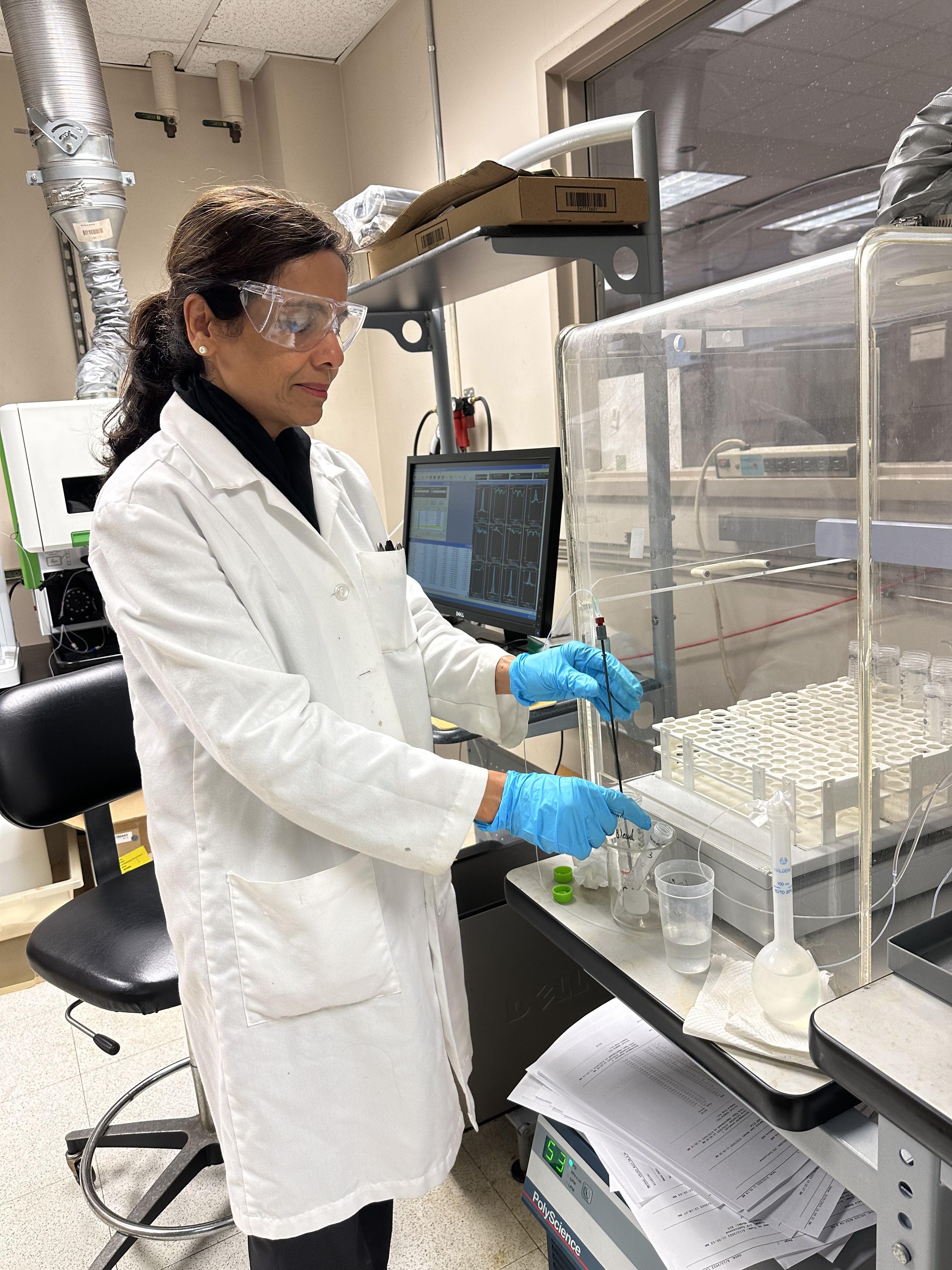 Tabassum Shah, Research Coordinator at Renewable Bioproducts Institute, testing black liquor using ICP Emission Spectrometer