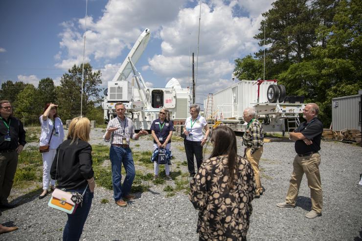 <p>Visitors are briefed on a phased-array radar intended to provide improved training capabilities on Department of Defense ranges. (Credit: Sean McNeil, GTRI)</p>