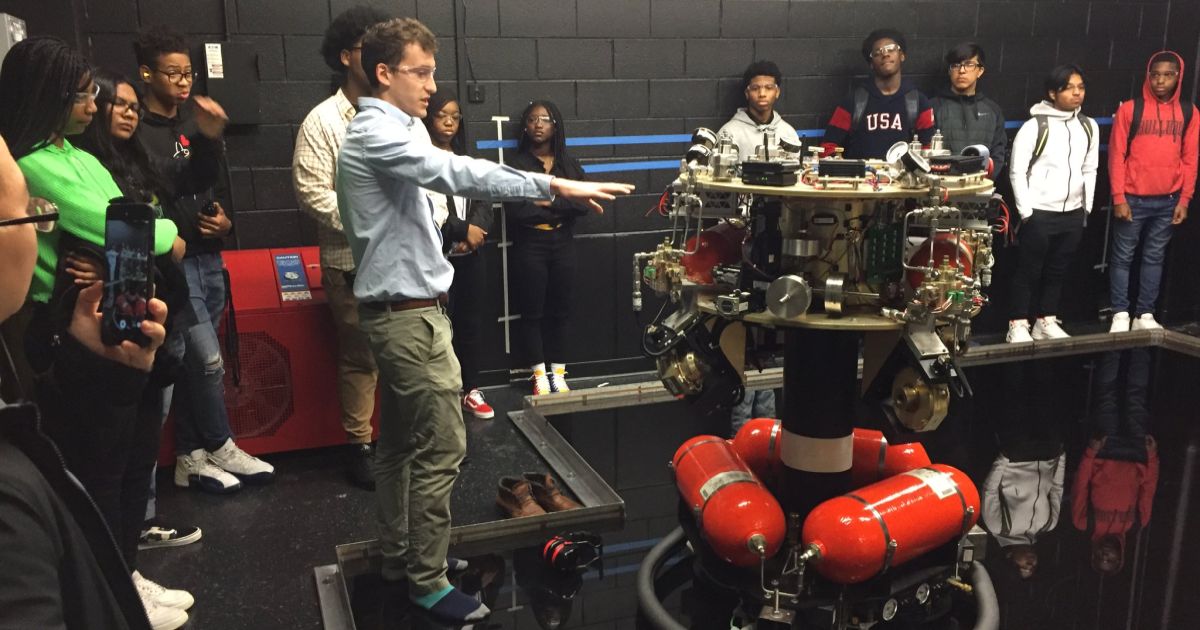 Robograds leading a tour of safety robotics lab