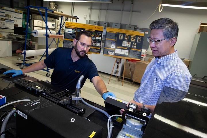 <p>Jarod Weber, CHMI project manager, and Chuck Zhang, CHMI director, perform and monitor plasma treatment surfaces of composite panels before they are bonded in GTMI’s Composite Joining and Repair (CJAR) Lab. Photo Credit: Candler Hobbs, Georgia Tech</p>