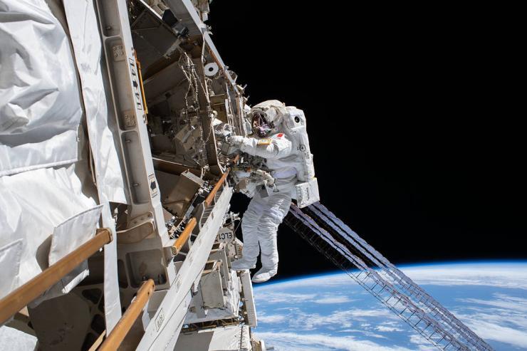 <p>Astronaut Luca Parmitano is pictured tethered to the International Space Station while finalizing thermal repairs on the Alpha Magnetic Spectrometer.</p>